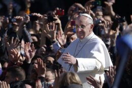 Pope Francis waves as he arrives in St. Peter's Square for his inauguration Mass at the Vatican, Tuesday, March 19, 2013.