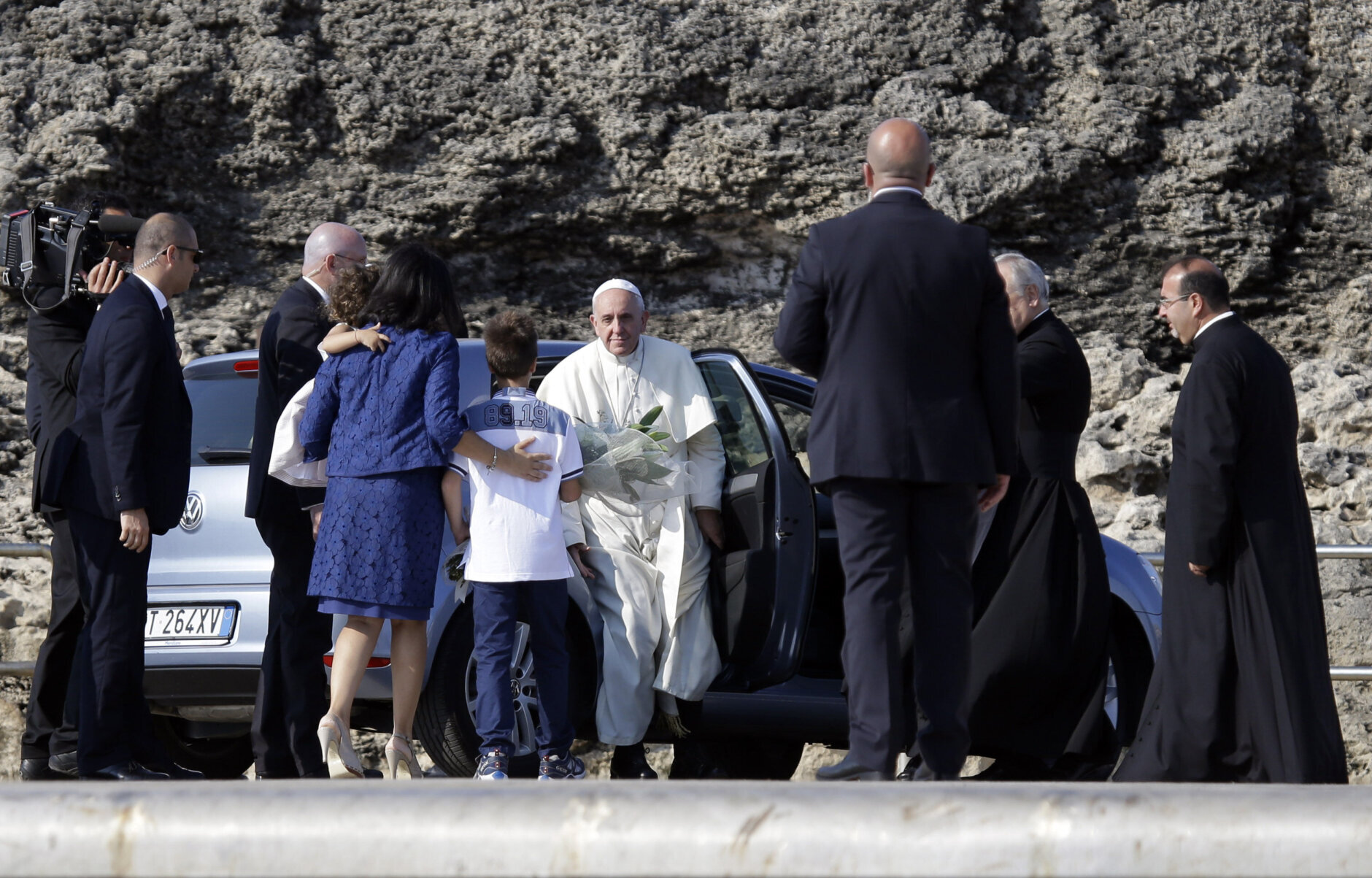 Pope Francis is greeted at the Italian island of Lampedusa to highlight the plight of migrants crossing the Mediterranean. This was his first trip outside of Rome.